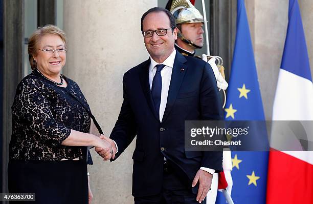 French President Francois Hollande welcomes President of Chile Michelle Bachelet prior to a meeting at the Elysee Palace on June 08 in Paris, France....