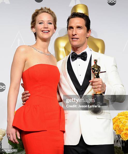 Actress Jennifer Lawrence and actor Matthew McConaughey pose in the
