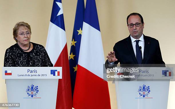 French President Francois Hollande delivers a speech next to President of Chile, Michelle Bachelet during a press conference after their meeting at...