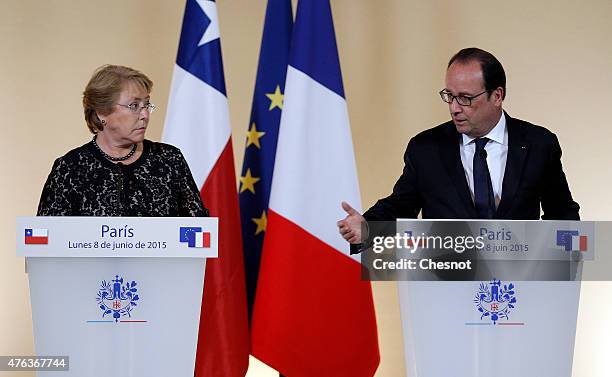 French President Francois Hollande delivers a speech next to President of Chile, Michelle Bachelet during a press conference after their meeting at...