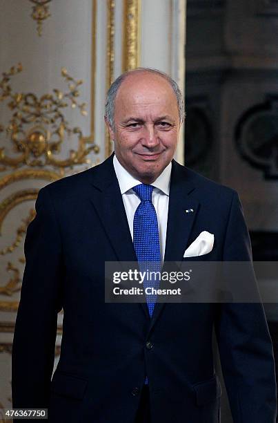 Laurent Fabius, French Minister of Foreign Affairs and International Development arrives to attend a press conference with President of Chile...