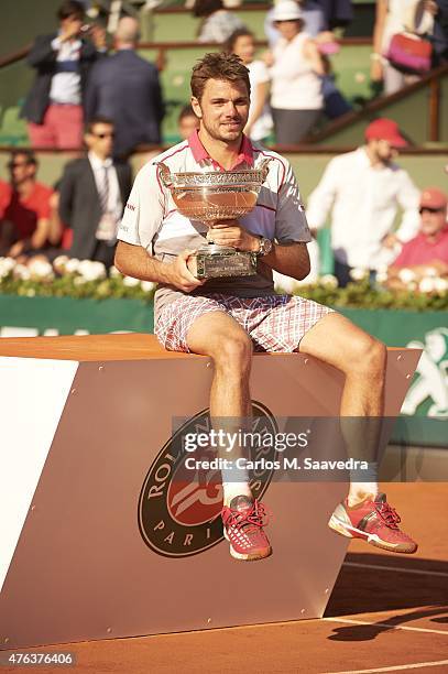 Switzerland Stanislas Wawrinka victorious with Coupe des Mousquetaires trophy after winning Men's Final vs Serbia Novak Djokovic at Stade Roland...