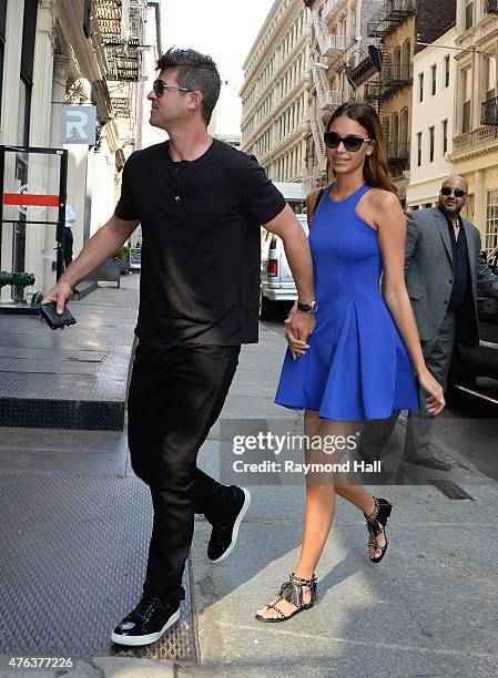 Singer Robin Thicke and April Love Geary are seen walking in Soho on June 8, 2015 in New York City.