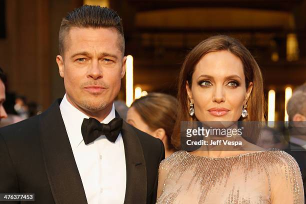 Actor Brad Pitt and Angelina Jolie attend the 86th Oscars held at Hollywood & Highland Center on March 2, 2014 in Hollywood, California.