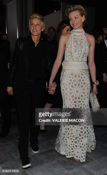 Comedian and Oscars host Ellen DeGeneres arrives with Portia de Rossi at the Governor's Ball following the 86th Academy Awards on March 2nd, 2014 in...
