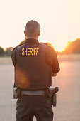 County Sheriff Police Officer at sunset
