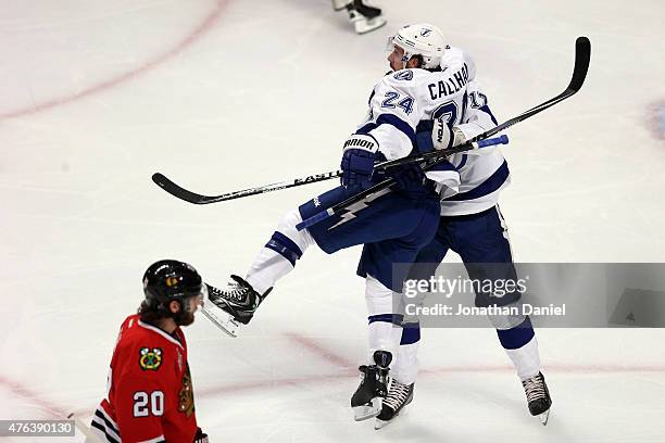 Ryan Callahan of the Tampa Bay Lightning celebrates with teammate Alex Killorn after scoring a goal on Corey Crawford of the Chicago Blackhawks in...