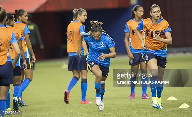 Brazil's Marta runs during a training session in Montreal on June 8, 2015 on the eve of Brazil's opening Group E match against South Korea at the...