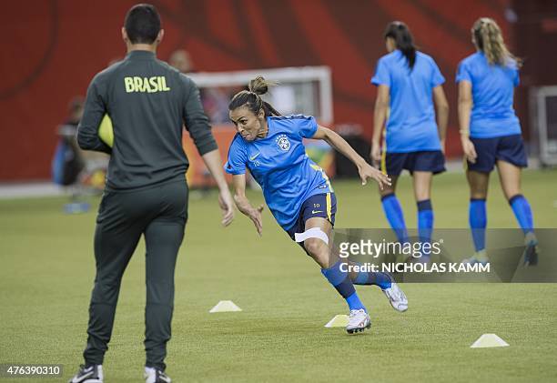 Brazil's Marta runs during a training session in Montreal on June 8, 2015 on the eve of Brazil's opening Group E match against South Korea at the...