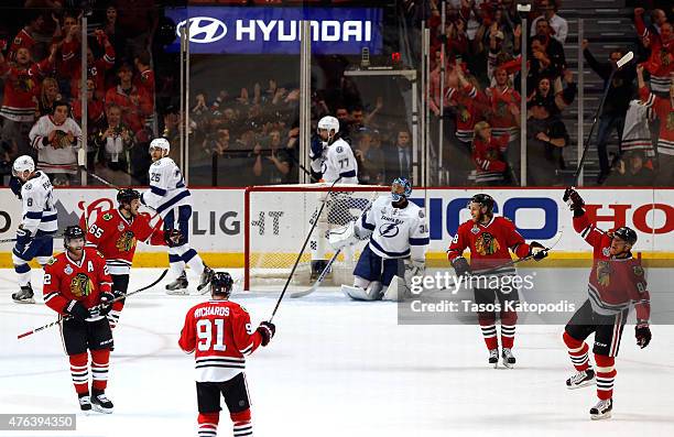 Brad Richards of the Chicago Blackhawks celebrates with teammates after scoring a first period goal against the Tampa Bay Lightning during Game Three...