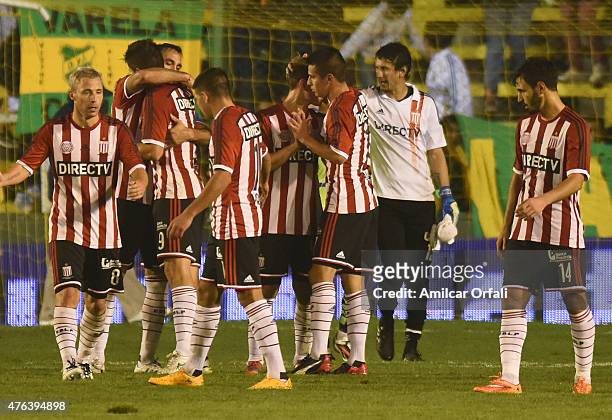 Guido Carrillo and his teammates of Estudiantes celebrate after winning a match between Defensa y Justicia and Estudiantes as part of 15th round of...