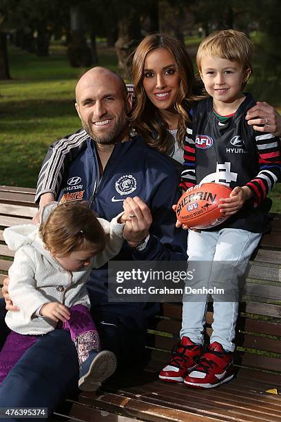 Chris Judd, Rebecca Judd and their children Oscar Judd and Billie Judd pose following a Carlton Blues AFL press conference announcing Chris's...