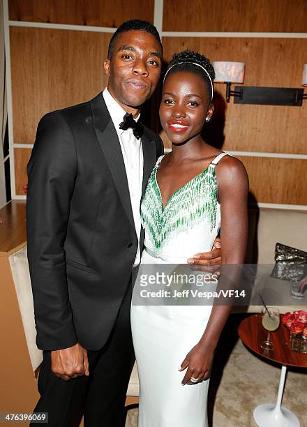 Actors Lupita Nyong'o and Chadwick Boseman attend the 2014 Vanity Fair Oscar Party Hosted By Graydon Carter on March 2, 2014 in West Hollywood,...