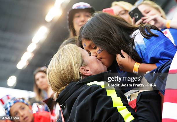 Jill Ellis head coach of the USA kisses a fan in the crowd after the FIFA Women's World Cup Canada 2015 Group D match between Sweden and Nigeria at...