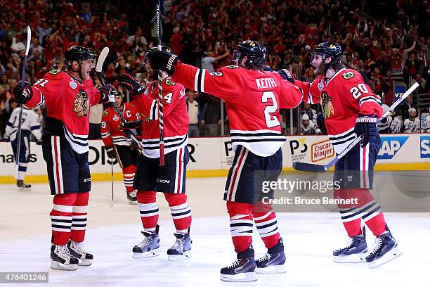 Brandon Saad of the Chicago Blackhawks celebrates with teammates after scoring a third period goal against the Tampa Bay Lightning during Game Three...