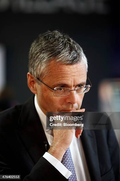 Michel Combes, chief executive officer of Alcatel-Lucent SA, pauses during a Bloomberg Television interview on the opening day of the Mobile World...