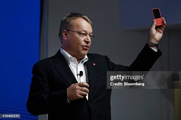 Stephen Elop, head of devices at Nokia Oyj, holds a Nokia Asha 200 low cost budget mobile smartphone during a news conference on the opening day of...