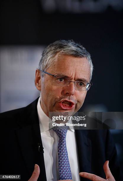 Michel Combes, chief executive officer of Alcatel-Lucent SA, speaks during a Bloomberg Television interview on the opening day of the Mobile World...