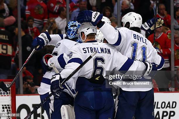 Ben Bishop of the Tampa Bay Lightning celebrates with his teammates after defeating the Chicago Blackhawks 3-2 in Game Three of the 2015 NHL Stanley...