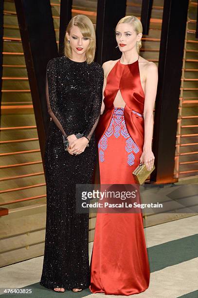 Recording artist Taylor Swift and actress Jaime King attend the 2014 Vanity Fair Oscar Party hosted by Graydon Carter on March 2, 2014 in West...