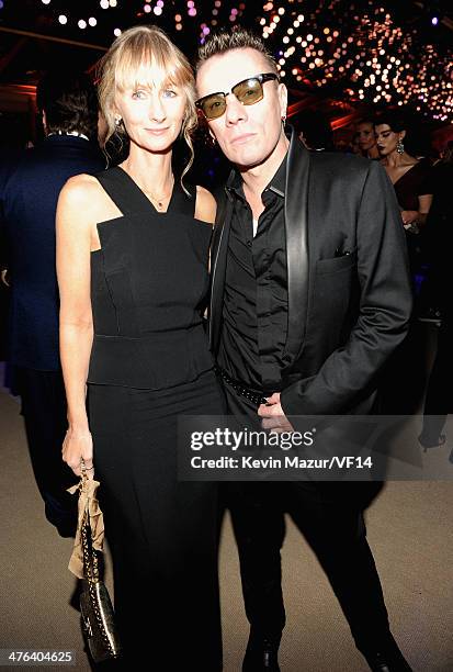 Ann Acheson and Larry Mullen, Jr. Attend the 2014 Vanity Fair Oscar Party Hosted By Graydon Carter on March 2, 2014 in West Hollywood, California.