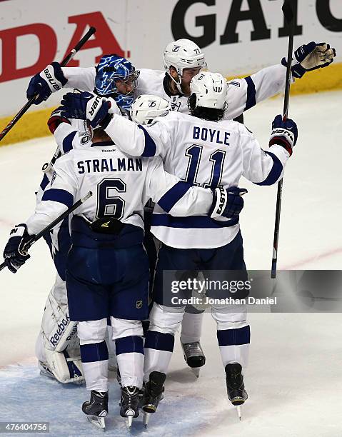 Ben Bishop of the Tampa Bay Lightning celebrates with his teammates after defeating the Chicago Blackhawks 3-2 in Game Three of the 2015 NHL Stanley...