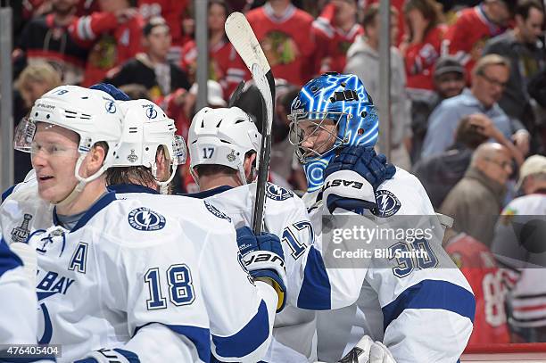 Goalie Ben Bishop of the Tampa Bay Lightning celebrates with teammates after defeating the Chicago Blackhawks 3-2 during Game Three of the 2015 NHL...