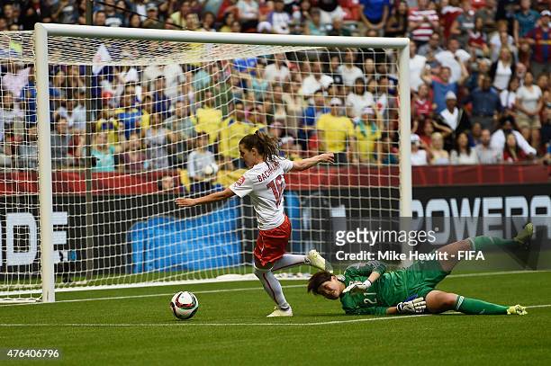 Ramona Bachmann of Switzerland gets past Erina Yamane of Japan but runs into touch during the FIFA Women's World Cup 2015 Group C match between Japan...