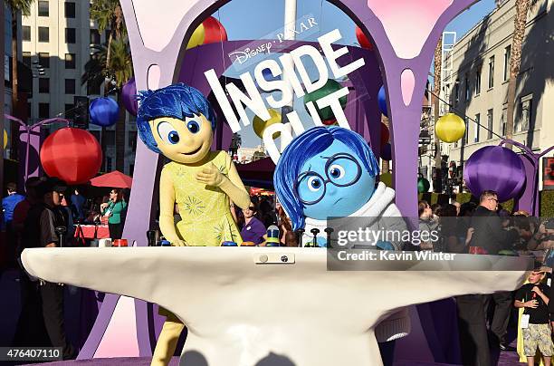 Film characters Joy and Sadness attend the Los Angeles premiere of Disney-Pixar's "Inside Out" at the El Capitan Theatre on June 8, 2015 in...