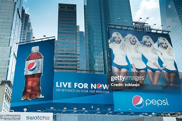 pepsi billboards at times square - pepsi centre stock pictures, royalty-free photos & images