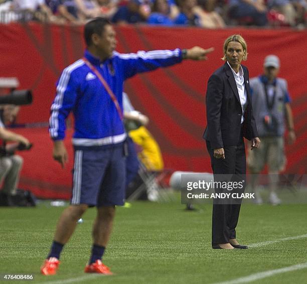 Switzerland coach Martina Voss-Tecklenburg looks over at Japan coach Norio Sasaki during a Group C football match between Switzerland and Japan at BC...