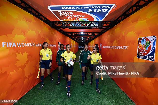 Match officials led by referee Lucila Venegas emerge for the second half during the FIFA Women's World Cup 2015 Group C match between Japan and...