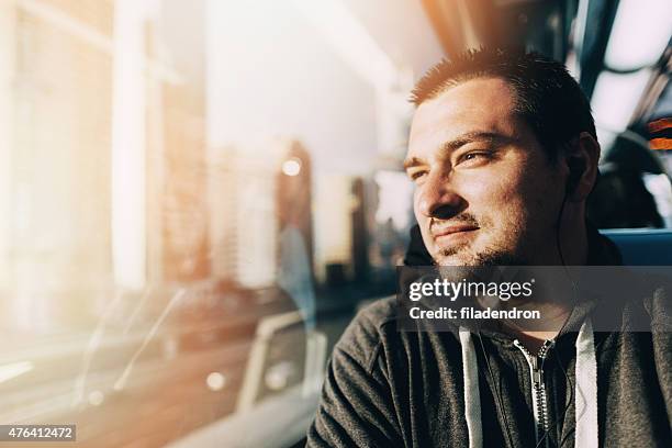 young man  traveling in the train - sunny window stock pictures, royalty-free photos & images