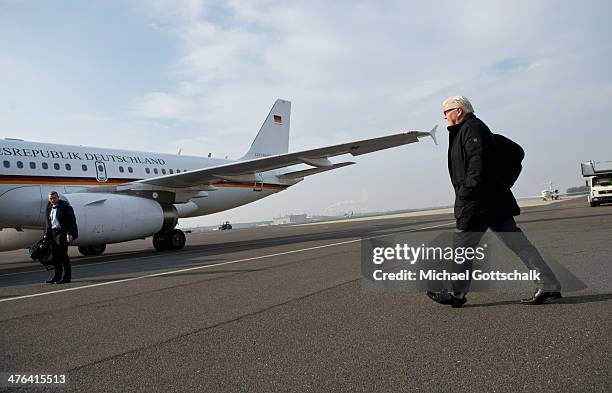 German Foreign Minister Frank-Walter Steinmeier walks to a plane to travel to a special session of EU Council for Foreign Relations on March 03, 2014...
