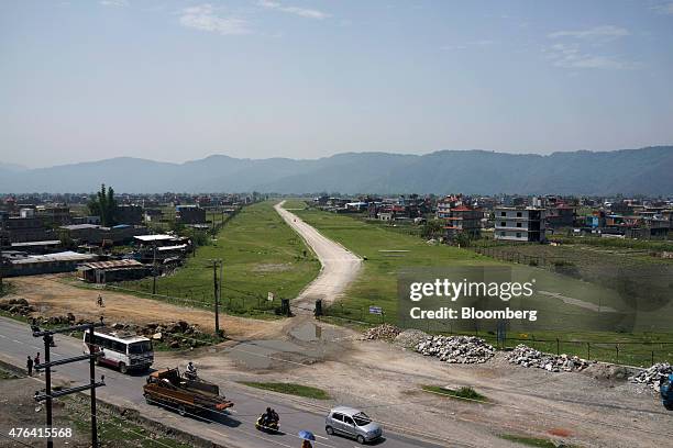 An airstrip sits under construction at the proposed site for a new airport in Pokhara, Nepal, on Tuesday, June 2, 2015. Nepal's gross domestic...