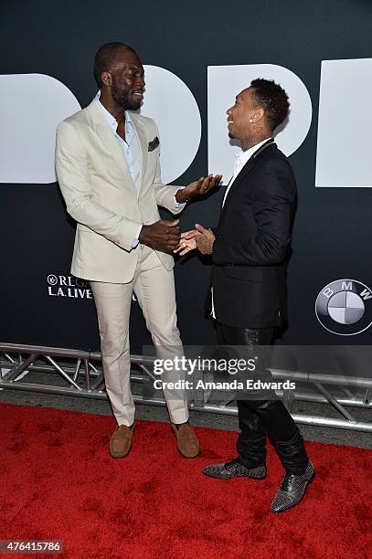 Writer/director/producer Rick Famuyiwa and actor/rapper Tyga attend the Los Angeles premiere of "Dope" in partnership with the Los Angeles Film...