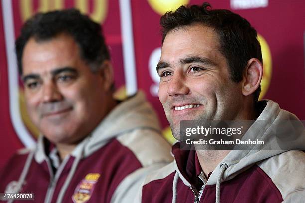 Maroons Coach Mal Meninga looks on as Cameron Smith talks to the media during the Queensland Maroons State of Origin team announcement at Melbourne...