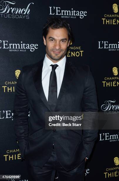 Actor Darwin Shaw arrives at The Academy Awards viewing party with Champagne Thienot at L'Ermitage Beverly Hills Hotel on March 2, 2014 in Beverly...