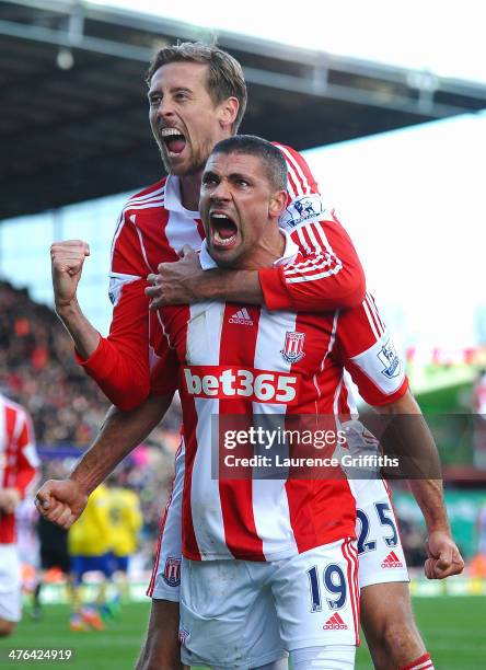 Jonathan Walters of Stoke City celebrates his goal with Peter Crouch during the Barclays Premier League match between Stoke City and Arsenal at...