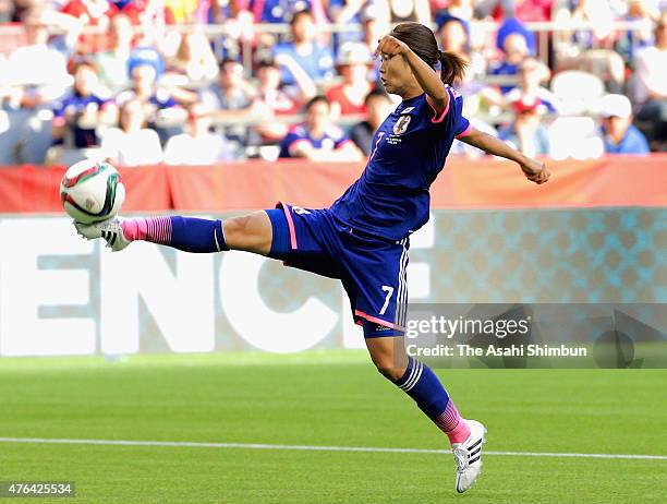 Kozue Ando of Japan controls the ball before being fouled by goalkeeper Gaelle Thalmann of Switzerland in the penalty area during the FIFA Women's...