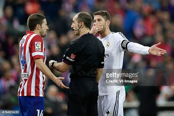 Gabi of Atletico Madrid, Referee Carlos Delgado, Sergio Ramos of Real Madrid during the Spanish Primera División match between Atletico Madrid and...
