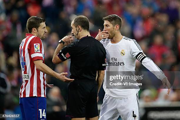 Gabi of Atletico Madrid, Referee Carlos Delgado, Sergio Ramos of Real Madrid during the Spanish Primera División match between Atletico Madrid and...