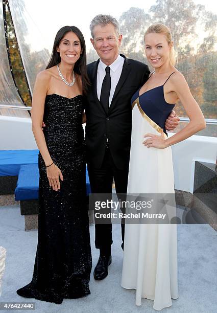 Berna Ozlem, David Foster, and Cassandra Mann attend dinner during Alfred Mann Foundation's an Evening Under The Stars with Andrea Bocelli on June 8,...