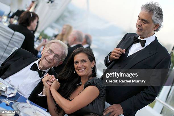 Alfred Mann, Veronica Berti, and Andrea Bocelli attend dinner during Alfred Mann Foundation's an Evening Under The Stars with Andrea Bocelli on June...