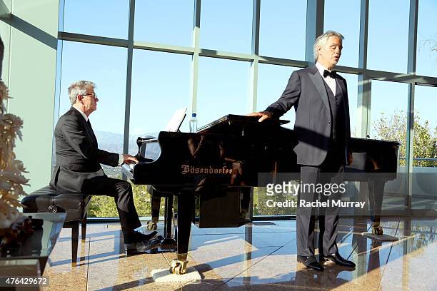 Recording Artist David Foster and Maestro Andrea Bocelli perform a private concert for guests during Alfred Mann Foundation's an Evening Under The...