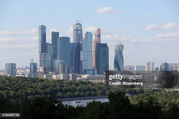 The skyscrapers of Moscow City business district stand on the horizon beyond the Moscow river in Moscow, Russia, on Monday, June 8, 2015. Rents in...