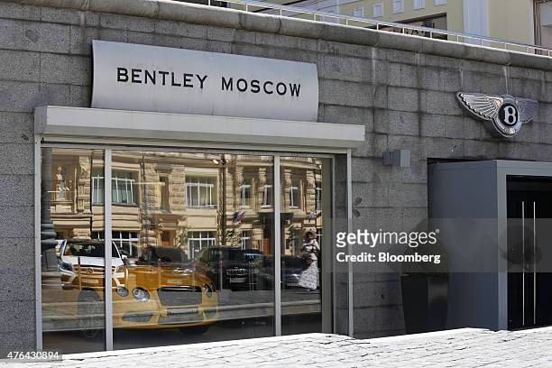 Bentley automobile sits in the window of a Bentley Motors Ltd. Moscow dealership on Tretyakov Drive in Moscow, Russia, on Monday, June 8, 2015. Rents...
