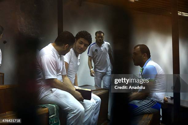 Defendants are seen behind the bars during the trial of Port Said case in Cairo, Egypt on June 9, 2015. An Egyptian court on Tuesday sentenced 11...