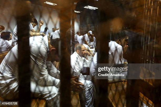 Defendants are seen behind the bars during the trial of Port Said case in Cairo, Egypt on June 9, 2015. An Egyptian court on Tuesday sentenced 11...