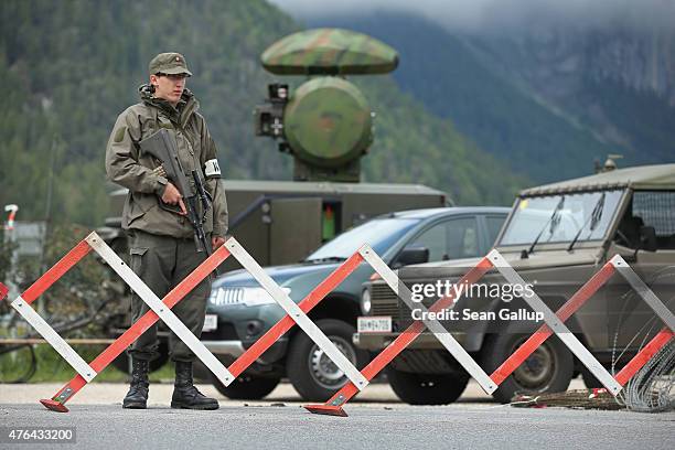 Soldier of the Austrian army stands next to a mobile radar station that is safeguarding the upcoming Bilderberg conference on June 9, 2015 near...